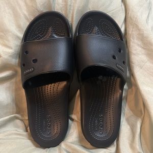 Almost like new Crocs slide. WN 8. Black